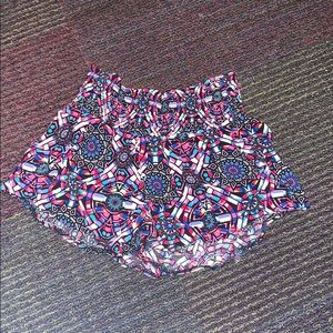 Colorful flowy shorts.
